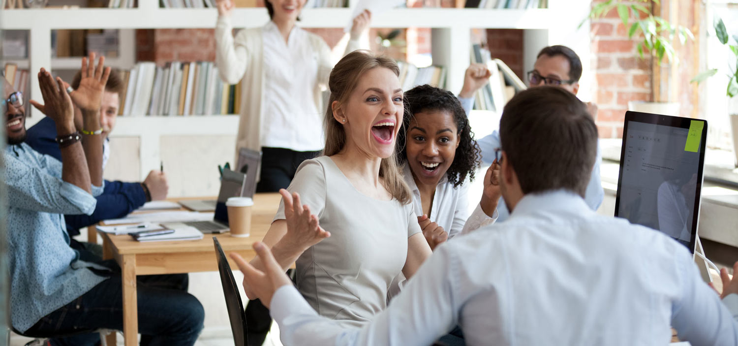 excited colleagues celebrating